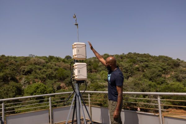 Mogesh Naidoo, Research Scientist at Council for Scientific and Industrial Research (CSIR) checks air sampling station.