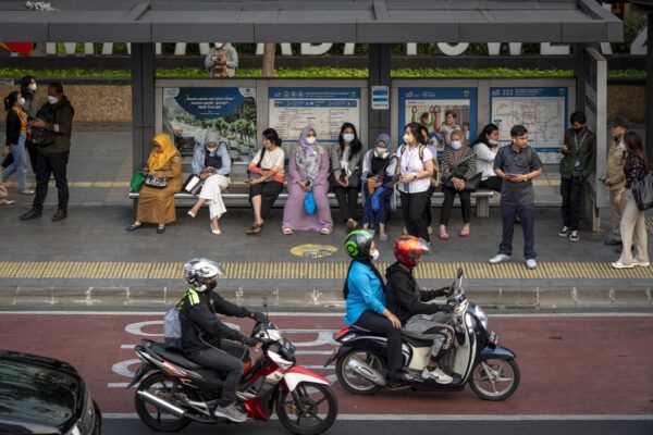 Commuters wait for public transportation in Jakarta, Indonesia on November 7, 2023. Millions of residents of Jakarta have for the past several months suffered from some of the worst air pollution levels in the world.