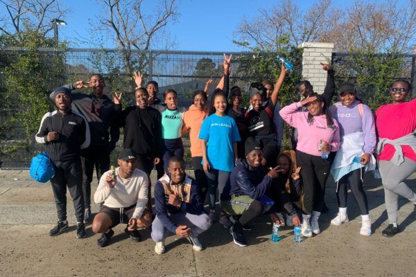 Group of young runners wear air quality sensors