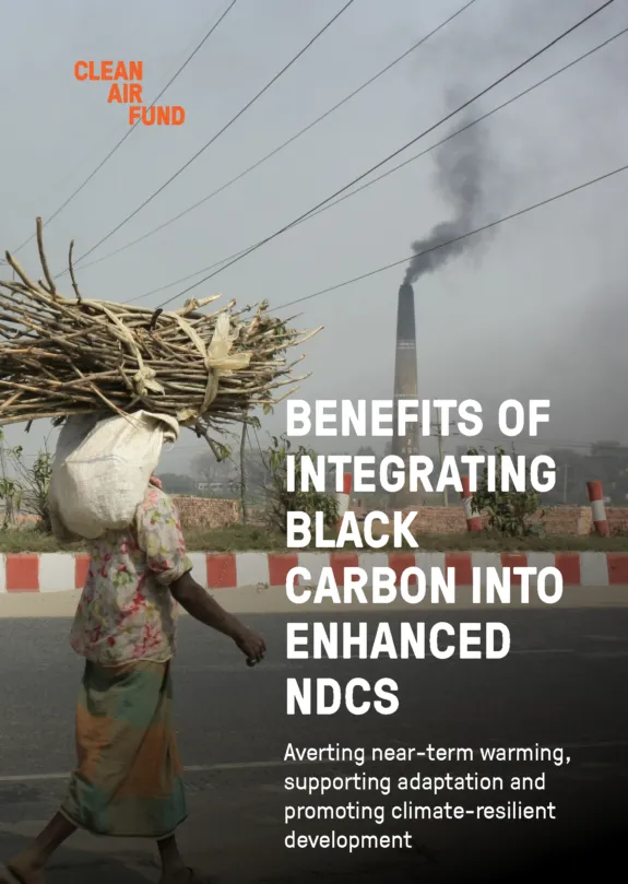 Cover of report showing a man walking with black carbon smoke from a brick kiln